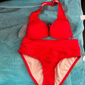 Mynah brand, the color is haute red. This bathing suit is an extra small.